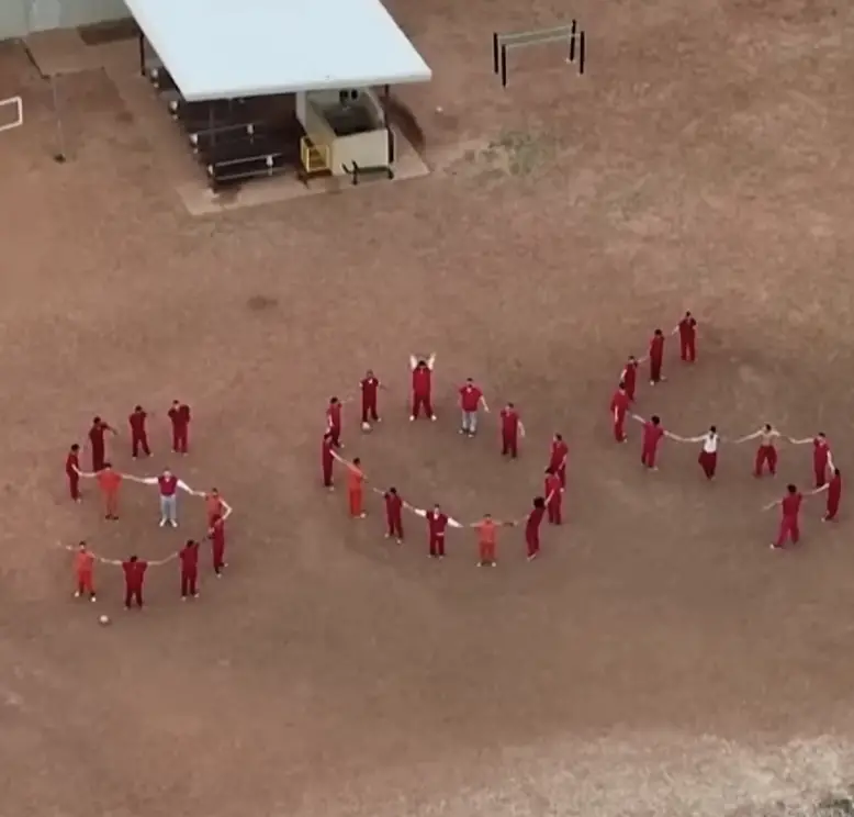 Migrants Detained In ‘World’s Worst Prison’ Spell Out Chilling Message With Their Bodies In Prison Yard